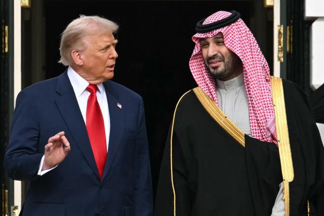 (FILES) US President Donald Trump (L) greets Crown Prince and Prime Minister of the Kingdom of Saudi Arabia Mohammed bin Salman on the South Lawn at the White House in Washington, DC on November 18, 2025. US President Donald Trump said on July 23, 2026, that a nuclear deal with Saudi Arabia depends on the kingdom recognizing Israel -- throwing the agreement into turmoil just the day after it was signed. Riyadh has long resisted joining the so-called Abraham Accords with Israel, insisting especially after the Gaza conflict on a pathway to a Palestinian state. (Photo by SAUL LOEB / AFP)