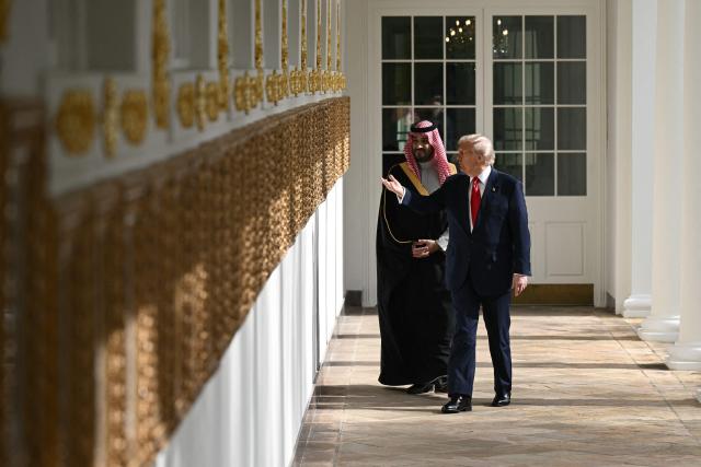 (FILES) US President Donald Trump (R) and Crown Prince and Prime Minister of the Kingdom of Saudi Arabia Mohammed bin Salman walk down the Colonnade on the way to the Oval Office of the White House in Washington, DC on November 18, 2025. US President Donald Trump said on July 23, 2026, that a nuclear deal with Saudi Arabia depends on the kingdom recognizing Israel -- throwing the agreement into turmoil just the day after it was signed. Riyadh has long resisted joining the so-called Abraham Accords with Israel, insisting especially after the Gaza conflict on a pathway to a Palestinian state. (Photo by Brendan SMIALOWSKI / AFP)