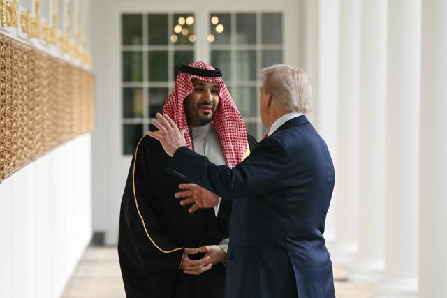 (FILES) US President Donald Trump and Crown Prince and Prime Minister of the Kingdom of Saudi Arabia Mohammed bin Salman speak with each other as they walk down the Colonnade on the way to the Oval Office of the White House in Washington, DC on November 18, 2025. US President Donald Trump said on July 23, 2026, that a nuclear deal with Saudi Arabia depends on the kingdom recognizing Israel -- throwing the agreement into turmoil just the day after it was signed. Riyadh has long resisted joining the so-called Abraham Accords with Israel, insisting especially after the Gaza conflict on a pathway to a Palestinian state. (Photo by Brendan SMIALOWSKI / AFP)