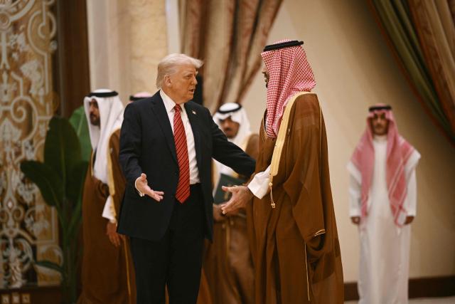 (FILES) US President Donald Trump speaks with Saudi Crown Prince Mohammed bin Salman before posing for a family picture with Gulf leaders during a gathering of the six-nation Gulf Cooperation Council (GCC) in Riyadh on May 14, 2025. US President Donald Trump said on July 23, 2026, that a nuclear deal with Saudi Arabia depends on the kingdom recognizing Israel -- throwing the agreement into turmoil just the day after it was signed. Riyadh has long resisted joining the so-called Abraham Accords with Israel, insisting especially after the Gaza conflict on a pathway to a Palestinian state. (Photo by Brendan SMIALOWSKI / AFP)