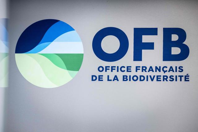 This photograph shows the logo of the Office Francais de la Biodiversite - OFB (French Office for Biodiversity) displayed on the facade of its' headquarters, in Vincennes, suburb of Paris on July 23, 2026. (Photo by Lou BENOIST / AFP)