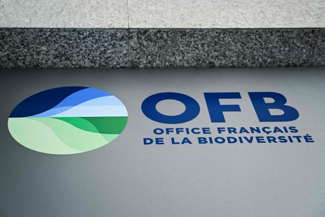 This photograph shows the logo of the Office Francais de la Biodiversite - OFB (French Office for Biodiversity) displayed on the facade of its' headquarters, in Vincennes, suburb of Paris on July 23, 2026. (Photo by Lou BENOIST / AFP)