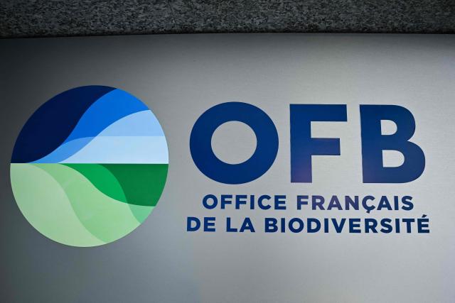 This photograph shows the logo of the Office Francais de la Biodiversite - OFB (French Office for Biodiversity) displayed on the facade of its' headquarters, in Vincennes, suburb of Paris on July 23, 2026. (Photo by Lou BENOIST / AFP)
