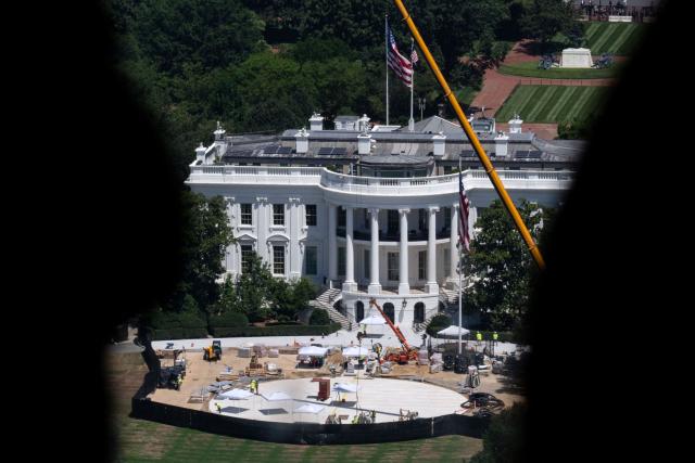 A view of the on-going helipad construction on the South Lawn of the White House, as seen from the Washington Monument observation deck in Washington, DC on July 23, 2026. The landing site aims to solve problems associated with the new fleet of presidential helicopters built by Sikorsky. (Photo by Kent Nishimura / AFP)