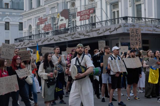 Protesters hold placards during on the eighth day of a demonstration against Ukraine's President's decision to dismiss Ukraine's former Defence Minister, in Kyiv on July 23, 2026, amid the Russian invasion of Ukraine. Ukraine's ex-defence minister -- whose ousting trigged a week of protests and forced out the country's commander-in-chief -- said on July 23, 2026, he was rejecting offers by Ukraine's President for a new role. (Photo by Tetiana DZHAFAROVA / AFP)