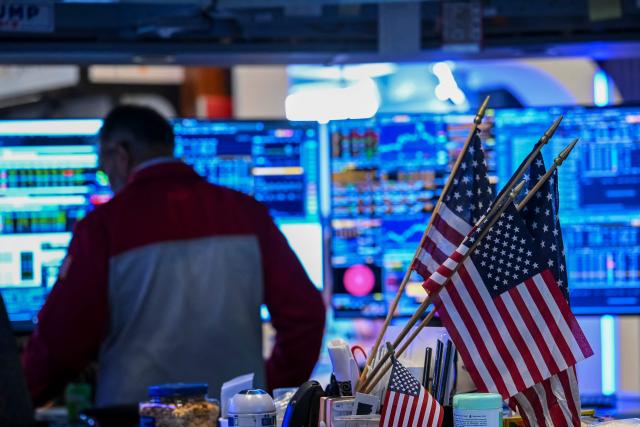 A trader works on the floor of the New York Stock Exchange (NYSE) in New York on July 23, 2026. Wall Street stocks tumbled on Thursday as oil prices shot higher on worsening effects of the US-Iran war while Tesla and Google parent Alphabet fell sharply after earnings reports.  International oil benchmark Brent North Sea crude topped $100 a barrel after Yemen's Iran-backed Houthi rebels struck oil tankers in the Red Sea. The attack brought the war roiling the Middle East to a new front. (Photo by ANGELA WEISS / AFP)