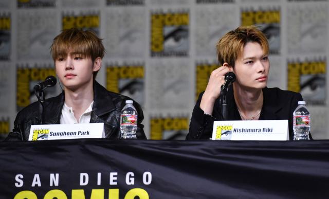 Members of South Korean band ENHYPEN Sunghoon Park (L) and Nishimura Riki attend the “Bite Me: Calling All Vampires” panel during Comic Con International in San Diego on July 23, 2026. (Photo by Chris DELMAS / AFP)