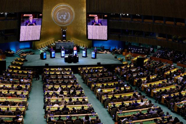 Attendees watch as the six candidates for the United Nations Secretary-General position debate at the UN General Assembly Hall in New York, on July 23, 2026. Chile’s former president Michelle Bachelet, Senegal’s former president Macky Sall, Costa Rican economist and Secretary-General of UNCTAD Rebeca Grynspan, Argentine diplomat and Director General of the International Atomic Energy Agency (IAEA) Rafael Mariano Grossi, Ecuadorean diplomat and former President of the UN General Assembly Maria Fernanda Espinosa, and Guyana’s former foreign minister Carolyn Rodrigues are vying to become the next UN Secretary-General. (Photo by Leonardo MUNOZ / AFP)