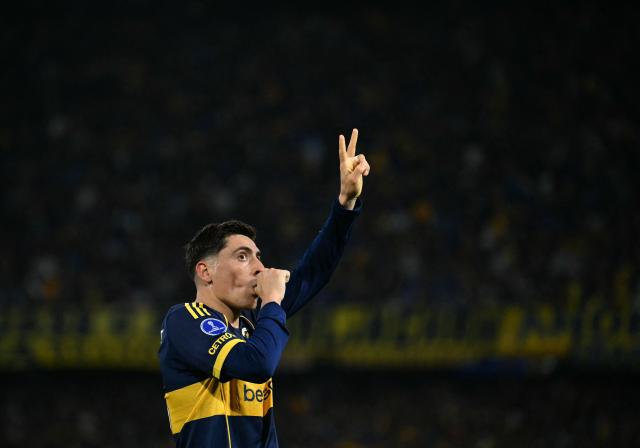 Boca Juniors' Uruguayan forward #16 Miguel Merentiel celebrates scoring his team's first goal during the first leg of the Copa Sudamericana knockout round play-off football match between Argentina's Boca Juniors and Chile's O'Higgins at La Bombonera stadium, in Buenos Aires, on July 23, 2026. (Photo by Luis ROBAYO / AFP)