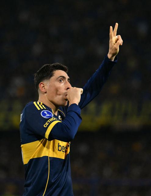 Boca Juniors' Uruguayan forward #16 Miguel Merentiel celebrates scoring his team's first goal during the first leg of the Copa Sudamericana knockout round play-off football match between Argentina's Boca Juniors and Chile's O'Higgins at La Bombonera stadium, in Buenos Aires, on July 23, 2026. (Photo by Luis ROBAYO / AFP)