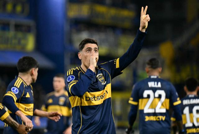 Boca Juniors' Uruguayan forward #16 Miguel Merentiel celebrates scoring his team's first goal during the first leg of the Copa Sudamericana knockout round play-off football match between Argentina's Boca Juniors and Chile's O'Higgins at La Bombonera stadium, in Buenos Aires, on July 23, 2026. (Photo by Luis ROBAYO / AFP)