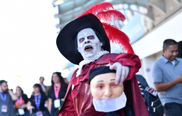 A Phantom of the Opera cosplayer poses outside the Convention Center during Comic Con International in San Diego on July 23, 2026. (Photo by Chris DELMAS / AFP)