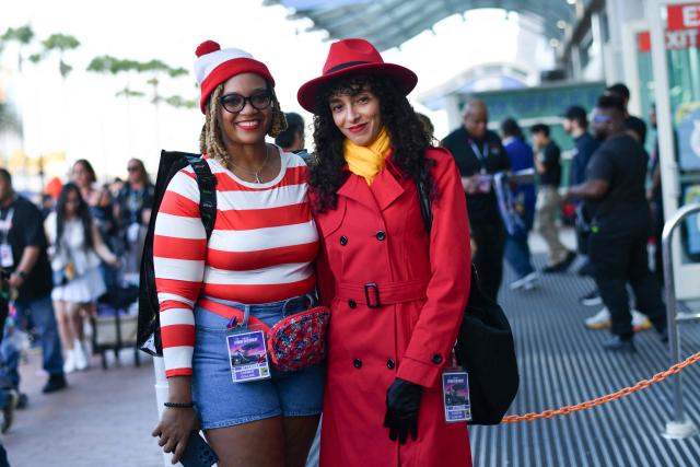A Carmen Sandiego and Where's Waldo cosplayers pose outside the Convention Center during Comic Con International in San Diego on July 23, 2026. (Photo by Chris DELMAS / AFP)
