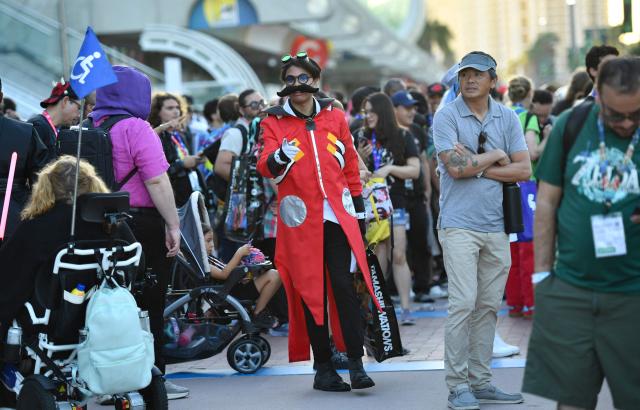 Cosplayers walk outside the Convention Center during Comic Con International in San Diego on July 23, 2026. (Photo by Chris DELMAS / AFP)