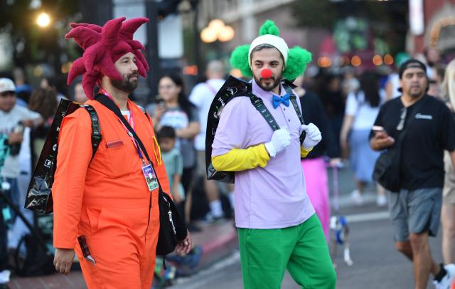 Cosplayers walk outside the Convention Center during Comic Con International in San Diego on July 23, 2026. (Photo by Chris DELMAS / AFP)
