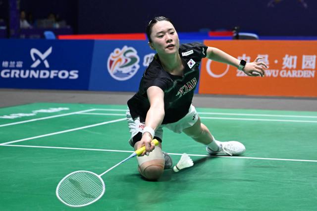 South Korea's Kim Ga-eun hits a return to China's Wang Zhiyi during their women's singles quarter final match at the China Open badminton tournament in Changzhou, eastern China's Jiangsu province on July 24, 2026. (Photo by CN-STR / AFP) / China OUT