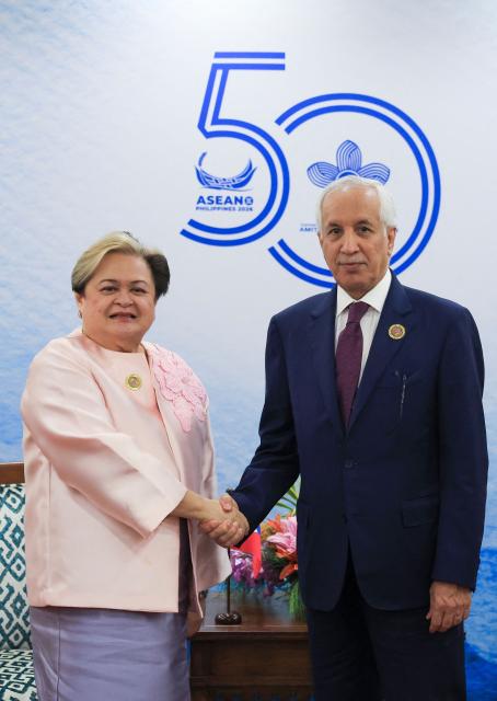 Philippines Foreign Secretary Theresa Lazaro and Qatari Minister of State for Foreign Affairs Sultan bin Saad Al-Muraikhi (R) shake hands during their bilateral meeting on the sidelines of the Association of Southeast Asian Nations (ASEAN) Foreign Ministers' Meeting in Pasay, Metro Manila on July 24, 2026. (Photo by Eloisa Lopez / POOL / AFP)