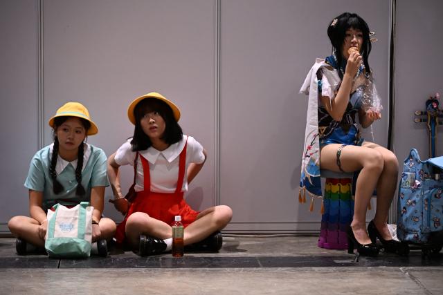 Participants in cosplay outfits attend the annual Ani-Com and Games exhibition at the Hong Kong Convention and Exhibition Centre in Hong Kong on July 25, 2025. (Photo by Peter PARKS / AFP)