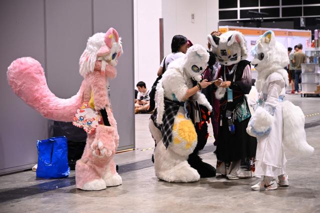Participants in cosplay outfits attend the annual Ani-Com and Games exhibition at the Hong Kong Convention and Exhibition Centre in Hong Kong on July 25, 2025. (Photo by Peter PARKS / AFP)