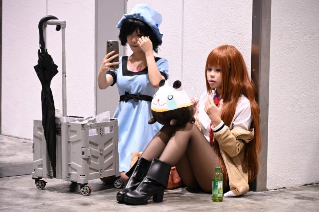 Participants in cosplay outfits attend the annual Ani-Com and Games exhibition at the Hong Kong Convention and Exhibition Centre in Hong Kong on July 25, 2025. (Photo by Peter PARKS / AFP)