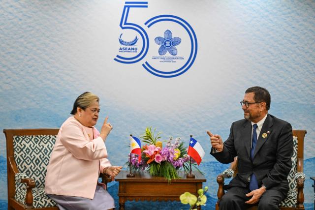 Philippine Foreign Affairs Secretary Theresa Lazaro (L) and Chile Foreign Affairs Minister Francisco Perez Mackenna (R) talk during a bilateral meeting on the sidelines of the Association of Southeast Asian Nations (ASEAN) foreign ministers' meetings in Pasay City, Metro Manila on July 24, 2026. (Photo by Jam STA ROSA / POOL / AFP)