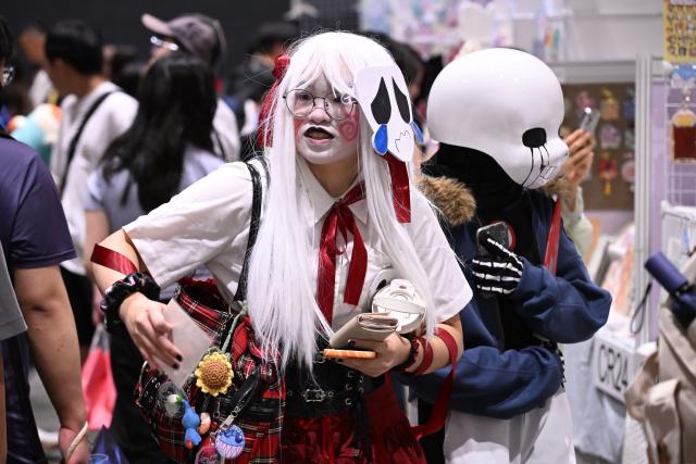Participants in cosplay outfits attend the annual Ani-Com and Games exhibition at the Hong Kong Convention and Exhibition Centre in Hong Kong on July 25, 2025. (Photo by Peter PARKS / AFP)