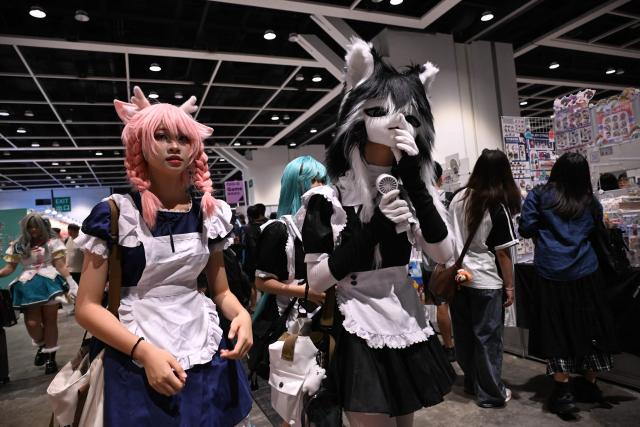 Participants in cosplay outfits attend the annual Ani-Com and Games exhibition at the Hong Kong Convention and Exhibition Centre in Hong Kong on July 25, 2025. (Photo by Peter PARKS / AFP)