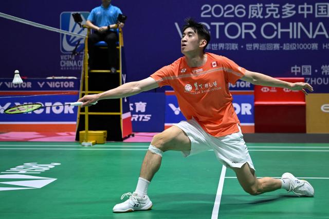 Canada's Victor Lai hits a return to Indonesia's Jonatan Christie during their men's singles quarter final match at the China Open badminton tournament in Changzhou, eastern China's Jiangsu province on July 24, 2026. (Photo by CN-STR / AFP) / China OUT