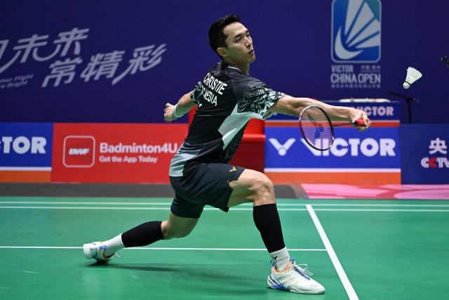 Indonesia's Jonatan Christie hits a return to Canada's Victor Lai during their men's singles quarter final match at the China Open badminton tournament in Changzhou, eastern China's Jiangsu province on July 24, 2026. (Photo by CN-STR / AFP) / China OUT