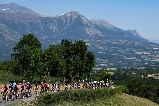 The pack of riders (peloton) cycles during the 19th stage of the 113th edition of the Tour de France cycling race, 127,9 km between Gap and Alpe d'Huez in the French Alps, on July 24, 2026. (Photo by Anne-Christine POUJOULAT / AFP)
