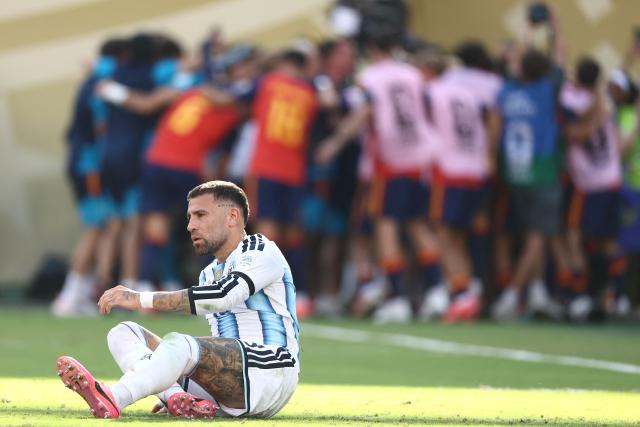 (FILES) Argentina's defender #19 Nicolas Otamendi sits on the pitch during the 2026 World Cup football tournament final match between Spain and Argentina at the New York/New Jersey Stadium in East Rutherford on July 19, 2026. Veteran centre-back Nicolas Otamendi announced his retirement from the Argentina national team on July 23, 2026, four days after their 1-0 defeat to Spain in extra time in the 2026 World Cup final. (Photo by CHARLY TRIBALLEAU / AFP)
