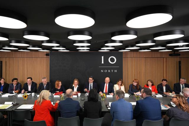 Britain's Prime Minister Andy Burnham holds a National Economic Council meeting at No 10 North at Heron House in Manchester, north-west England on July 24, 2026. British Prime Minister Andy Burnham opened his newly created northern office on Friday, as he bids to launch his flagship move to reverse decades of centralising power over England in London. (Photo by Christopher Furlong / POOL / AFP)