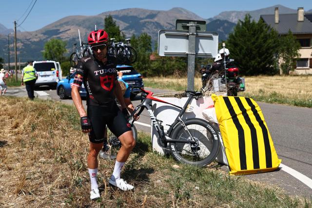 Tudor Pro Cycling Team's Austrian rider Marco Haller receives assistance after a crash during the 19th stage of the 113th edition of the Tour de France cycling race, 127,9 km between Gap and Alpe d'Huez in the French Alps, on July 24, 2026. (Photo by Anne-Christine POUJOULAT / AFP)