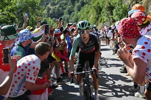 Decathlon CMA CGM Team's US rider Matthew Riccitello cycles in the Alpe d'Huez ascent during the 19th stage of the 113th edition of the Tour de France cycling race, 127,9 km between Gap and Alpe d'Huez in the French Alps, on July 24, 2026. (Photo by Loic VENANCE / AFP)