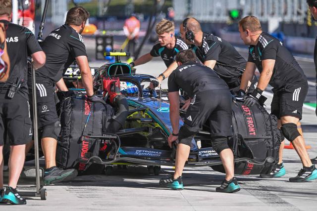 Mercedes' Italian driver Kimi Antonelli's car is pushed back to the pits by mechanics during the second practice of Formula One Hungarian Grand Prix at the Hungaroring circuit in Mogyorod near Budapest, Hungary, on July 24, 2026. (Photo by Attila KISBENEDEK / AFP)