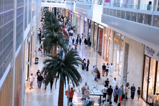 People wonder through one of Kuwait's biggest shopping malls, The Al-Khiran Mall, 80kms south of Kuwait City on July 24, 2026. (Photo by YASSER AL-ZAYYAT / AFP)