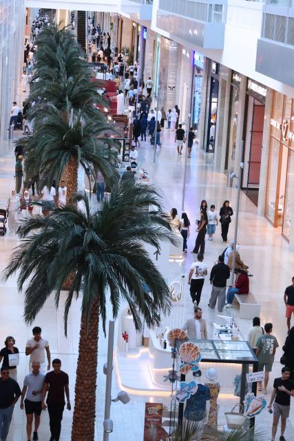 People wonder through one of Kuwait's biggest shopping malls, The Al-Khiran Mall, 80kms south of Kuwait City on July 24, 2026. (Photo by YASSER AL-ZAYYAT / AFP)