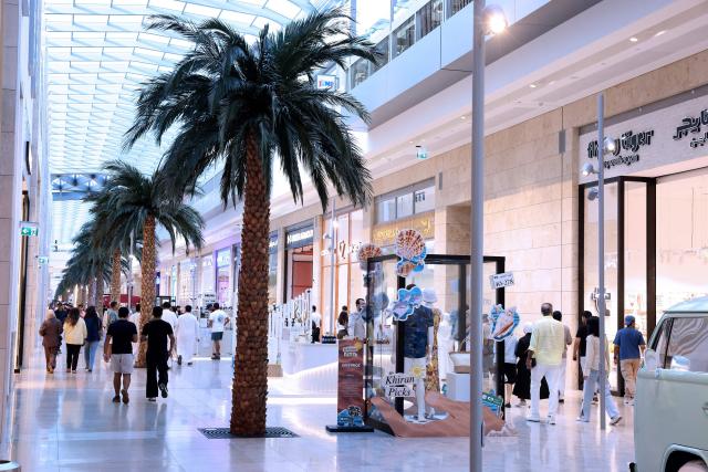 People wonder through one of Kuwait's biggest shopping malls, The Al-Khiran Mall, 80kms south of Kuwait City on July 24, 2026. (Photo by YASSER AL-ZAYYAT / AFP)