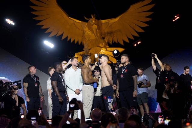 Britain's boxer Anthony Joshua (L) faces off with Albania's boxer Kristian Prenga during the weigh-in ceremony on the eve of their heavyweight bout in Jeddah on July 24, 2026. Briton Anthony Joshua, a two-time heavyweight champion, will face Kristian Prenga at "The Comeback" event in Saudi Arabia on July 25. (Photo by AFP)