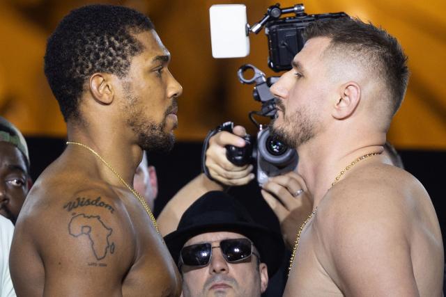 Britain's boxer Anthony Joshua (L) faces off with Albania's boxer Kristian Prenga during the weigh-in ceremony on the eve of their heavyweight bout in Jeddah on July 24, 2026. Briton Anthony Joshua, a two-time heavyweight champion, will face Kristian Prenga at "The Comeback" event in Saudi Arabia on July 25. (Photo by AFP)