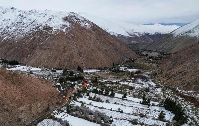 General view of Juntas de Valeriano in Huasco province, Atacama region, Chile on July 23, 2026. Heavy rains in Chile have killed at least 13 people and left more than 60,000 others cut off due to washed out roads, government officials said in a report on June 21, as the recovery effort focused on restoring basic services. (Photo by Jose TORRES / AFP)