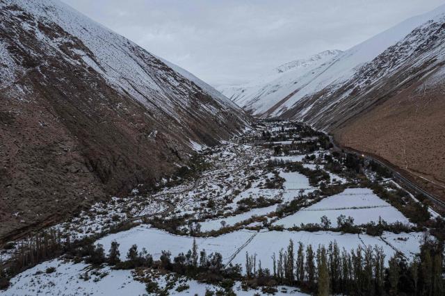General view of Juntas de Valeriano in Huasco province, Atacama region, Chile on July 23, 2026. Heavy rains in Chile have killed at least 13 people and left more than 60,000 others cut off due to washed out roads, government officials said in a report on June 21, as the recovery effort focused on restoring basic services. (Photo by Jose TORRES / AFP)