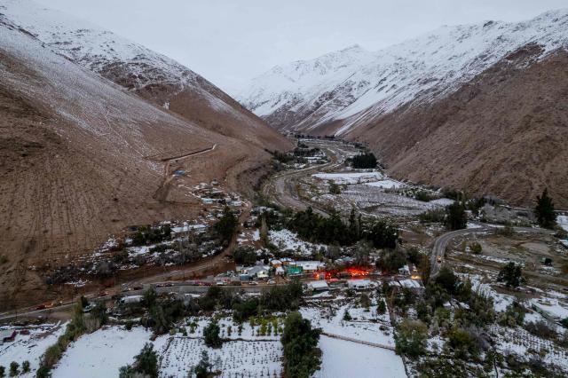 General view of Juntas de Valeriano in Huasco province, Atacama region, Chile on July 23, 2026. Heavy rains in Chile have killed at least 13 people and left more than 60,000 others cut off due to washed out roads, government officials said in a report on June 21, as the recovery effort focused on restoring basic services. (Photo by Jose TORRES / AFP)