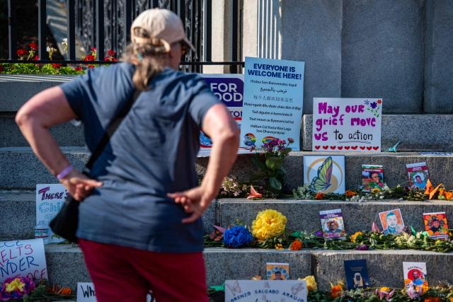 People view a memorial honoring people who have been killed during US Immigration and Customs Enforcement (ICE) operations on the steps of the State House during a 24-hour vigil in Boston, on July 24, 2026. (Photo by JOSEPH PREZIOSO / AFP)