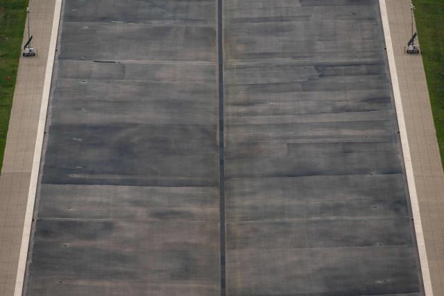 The currently drained Lincoln Memorial reflecting pool is seen from the observation deck of the Washington Monument in Washington, DC on July 24, 2026. (Photo by Kent Nishimura / AFP)