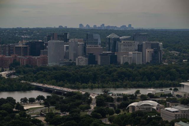 The Rosslyn, Virgina skyline is seen from the observation deck of the Washington Monument in Washington, DC on July 24, 2026. (Photo by Kent Nishimura / AFP)