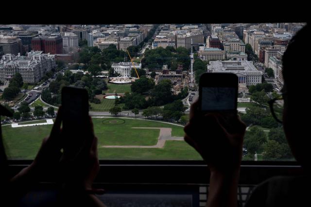 Visitors to the Washington Monument take in the view from the observation deck in Washington, DC on July 24, 2026. (Photo by Kent Nishimura / AFP)