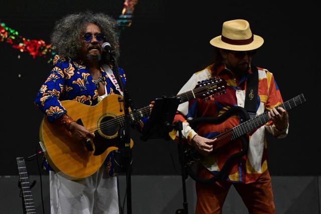Brazilian singer Chico Cesar (L) and Geraldo Azevedo perform during the Rio 2026 Winter Festival at Marina da Gloria in Rio de Janeiro, Brazil on July 24, 2026. (Photo by Pablo PORCIUNCULA / AFP)