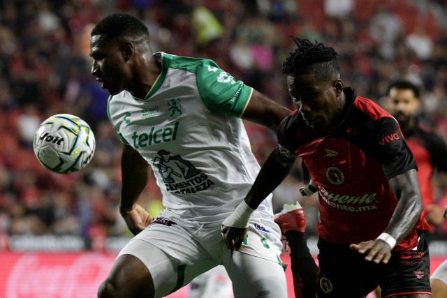 Leon's Colombian defender #14 Jhohan Romana and Tijuana's Ecuadorian forward #07 Adonis Preciado fight for the ball during the Liga MX Apertura football match between Tijuana and Leon at Caliente stadium in Tijuana, Mexico on July 24, 2026. (Photo by Guillermo Arias / AFP)