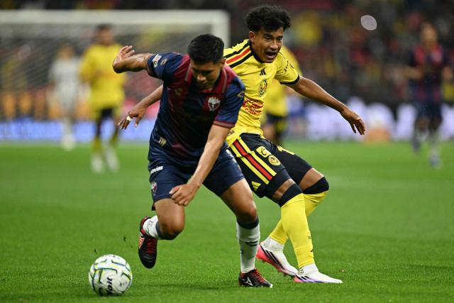 Atlante's defender #03 Gustavo Sanchez and America's forward #12 Isaias Violante fight for the ball during the Liga MX Apertura football match between Atlante and America at Banorte stadium (formerly known as Azteca) in Mexico City on July 24, 2026. (Photo by YURI CORTEZ / AFP)